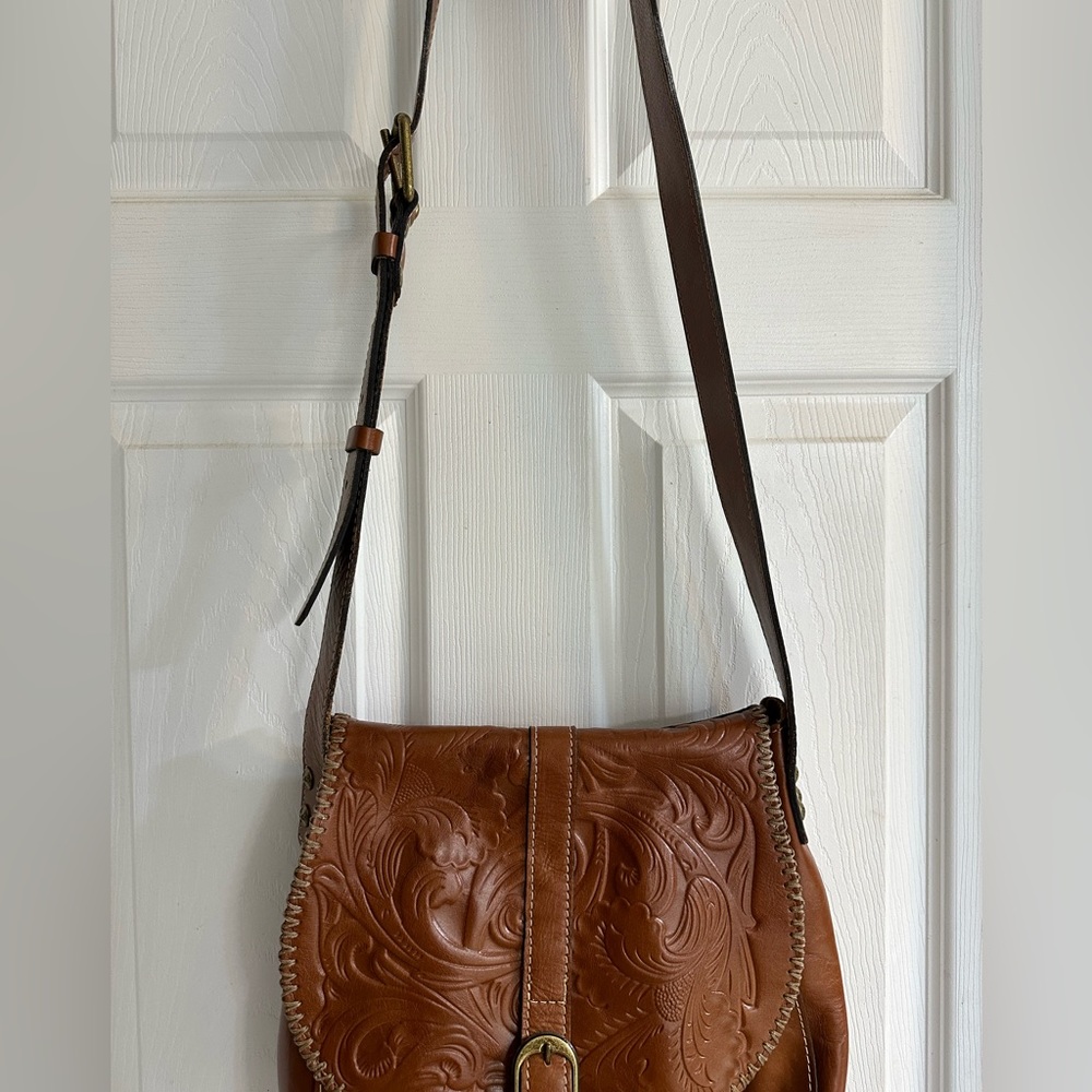 Patricia Nash like new large brown leather saddle bag.